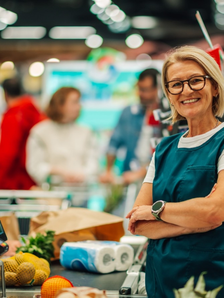supermarket-cashier-smiling-at-checkout-counter-10