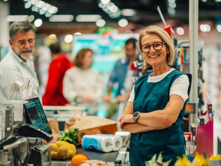 supermarket-cashier-smiling-at-checkout-counter-10